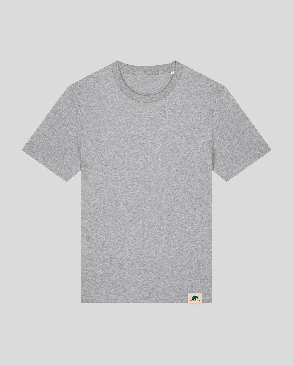Hellgraues T-Shirt mit Rundhalsausschnitt, schlichtem Design und ohne Aufdruck auf der Vorderseite. Am unteren rechten Saum befindet sich ein kleines, beiges Label mit einem grünen Elefantenlogo und der Aufschrift „Kölner Zoo“